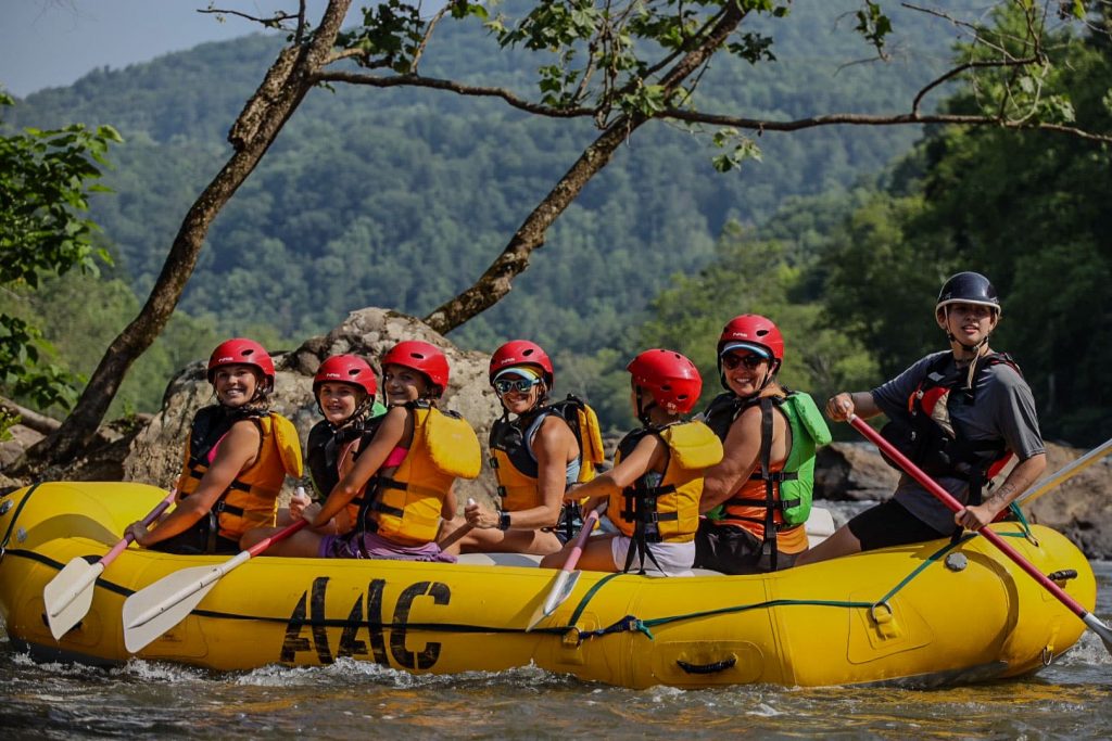 Group having fun rafting in the French Broad River by the Biltmore in Asheville